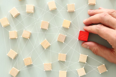 image of wooden blocks over mint table,building a strong team, human resources and management concept - Imageの写真素材