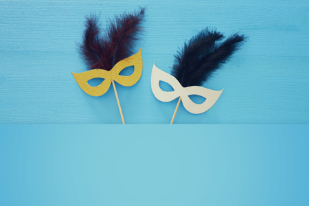carnival party celebration concept with masks blue wooden background. Top view.の写真素材