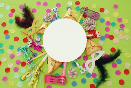 Purim celebration concept (jewish carnival holiday) over green wooden background. Top viewの写真素材