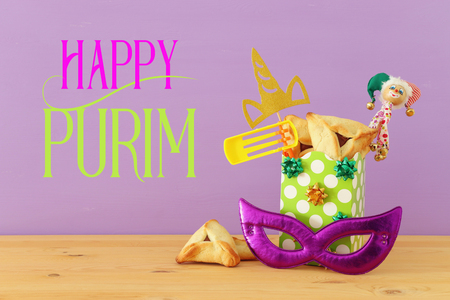 Purim celebration concept (Jewish carnival holiday) over wooden table backgroundの写真素材