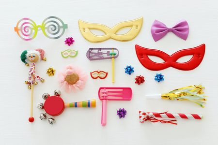 Purim celebration concept (Jewish carnival holiday) over wooden white backgroundの写真素材