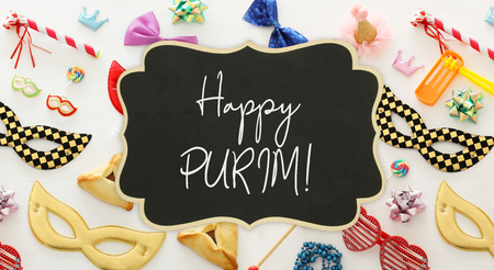 Purim celebration concept (jewish carnival holiday) over wooden white backgroundの写真素材