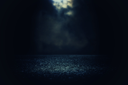 Spotlight over concrete floor. Dark black backgroundの写真素材