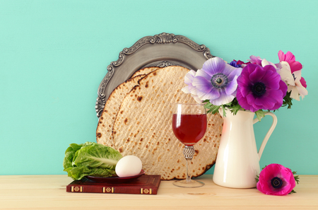 Pesah celebration concept (jewish Passover holiday) over wooden tableの写真素材