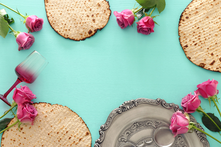Pesah celebration concept (jewish Passover holiday) over wooden mint background. Top view, flat layの写真素材