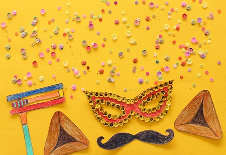 Purim celebration concept (jewish carnival holiday). Traditional symbols shapes cutted from paperの写真素材