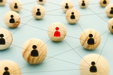 image of wooden blocks with people icons over mint table,building a strong team, human resources and management conceptの写真素材