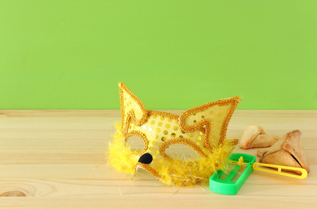 Purim celebration concept (Jewish carnival holiday). Traditional hamantaschen cookies in the basket over wooden tableの写真素材