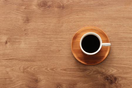coffee cup over wooden table . top viewの写真素材