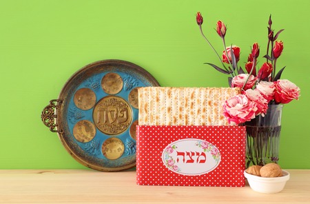 Pesah celebration concept (Jewish Passover holiday). Translation for Hebrew Text over plate: (PESAH)...