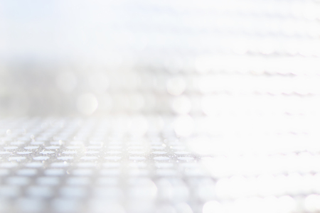 Photo white and silver glitter lights backgroundの写真素材