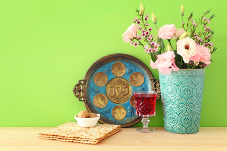 Pesah celebration concept (jewish Passover holiday). Translation for Hebrew Text over plate: (PESAH)...