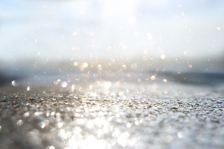 Glitter silver and gild lights background. De-focused.