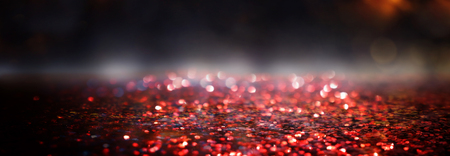 glitter vintage lights background. black, gold and red. de-focusedの写真素材