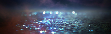 glitter vintage lights background. black, purple, blue and gold. de-focusedの写真素材