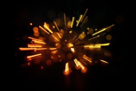 Abstract glitter lights background. Gold light burst. De-focusedの写真素材