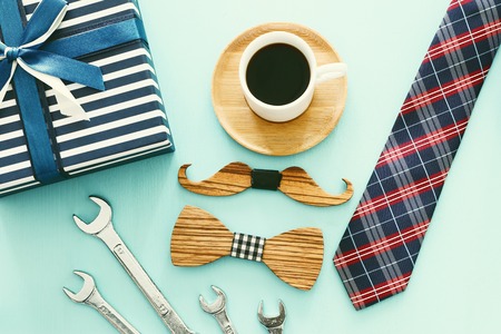 top view photo of gift box, necktie and cup of coffee. Father's day conceptの写真素材