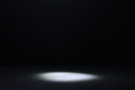 Abstract dark concentrate floor scene with mist or fog, spotlight and display