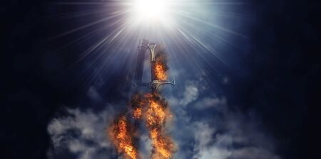 Mysterious and magical photo of silver sword with fire flames over Gothic black background. Medieval period conceptの写真素材