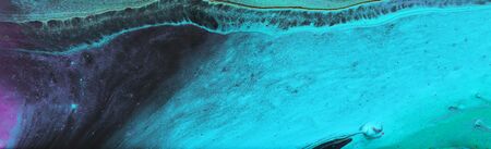Photography of abstract marbleized effect background. Black, turquoise and white creative colors....
