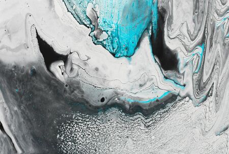 Photography of abstract marbleized effect background. Black, light turquoise and white creative...