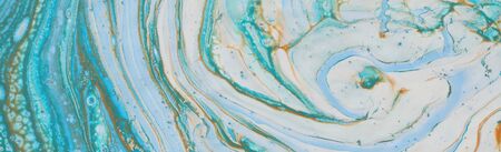 photography of abstract marbleized effect background. Blue, mint, gold and white creative colors. Beautiful paint. bannerの写真素材
