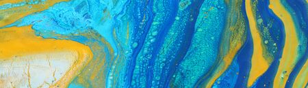 photography of abstract marbleized effect background. Blue, mint, yellow and white creative colors. Beautiful paint. bannerの写真素材