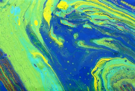 photography of abstract marbleized effect background. Blue and green creative colors. Beautiful...