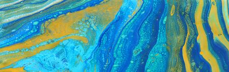 photography of abstract marbleized effect background. Blue, mint, yellow and white creative colors....