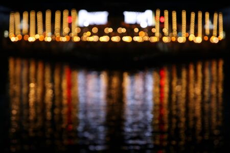background of abstract blurred night city, marina with lights reflactin backgroundの写真素材