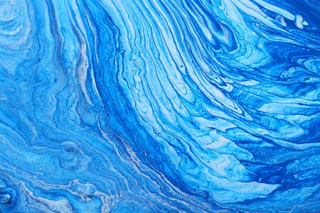 Photography of abstract marbleized effect background. Blue and white creative colors. Beautiful...