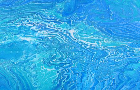 photography of abstract marbleized effect background. Blue and white creative colors. Beautiful...