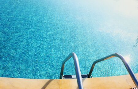 Background top view of swimming pool with stairの写真素材