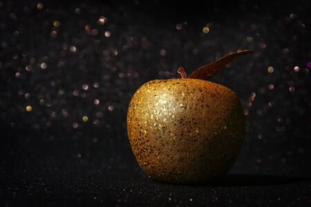 Rosh hashanah (Jewish New Year holiday) concept. Traditional symbol, decorative glitter gold appleの写真素材