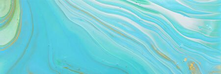 photography of abstract marbleized effect background. Blue, gold and turquoise creative colors....