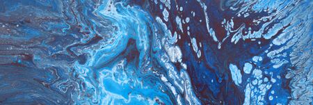 photography of abstract marbleized effect background. Blue and white creative colors. Beautiful...