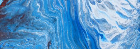 photography of abstract marbleized effect background. Blue and white creative colors. Beautiful...