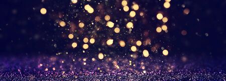 background of abstract glitter lights. blue, gold and black. de focused. bannerの写真素材