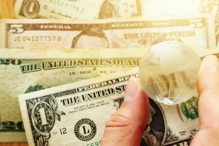 Business concept of dollar bills andglobe.Top view.Worldwide economy , financial management idea.の写真素材