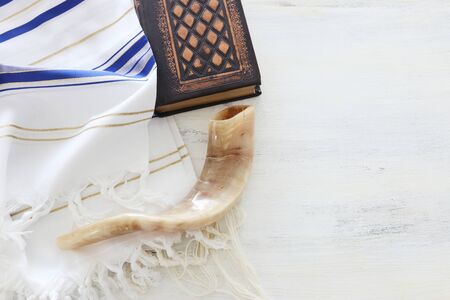 religion image of Prayer Shawl - Tallit, Prayer book and Shofar (horn) jewish religious symbols. Rosh hashanah (jewish New Year holiday), Shabbat and Yom kippur concept.の写真素材