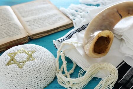 religion image of Prayer Shawl - Tallit, Prayer book and Shofar (horn) jewish religious symbols. Rosh hashanah (jewish New Year holiday), Shabbat and Yom kippur concept.の写真素材