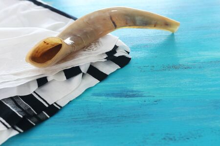 religion image of shofar (horn) on white prayer talit. Rosh hashanah (jewish New Year holiday),...