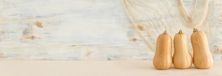 holidays Halloween image. pumpkin over wooden white tableの写真素材