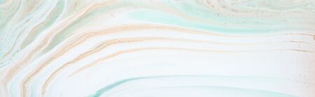 photography of abstract marbleized effect background. gold and white creative colors. Beautiful paint. bannerの写真素材