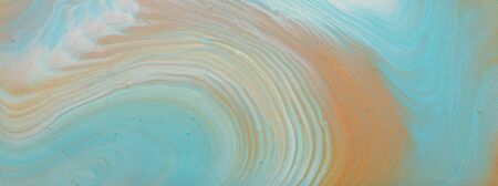photography of abstract marbleized effect background. turquoise, gold, blue and white creative...