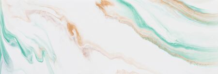 photography of abstract marbleized effect background. gold and white creative colors. Beautiful paint. bannerの写真素材