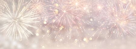 abstract gold and silver glitter background with fireworks. christmas eve, 4th of july holiday...