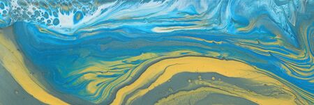 art photography of abstract marbleized effect background. blue, white and gold creative colors....