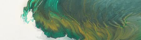 art photography of abstract marbleized effect background. emerald green, white and gold creative...