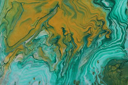 art photography of abstract marbleized effect background. emerald green, turquoise and gold creative...